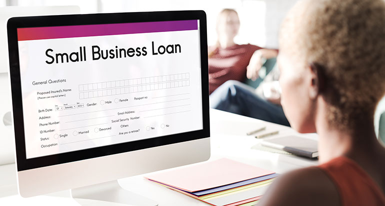 Woman filling in a small business loan application